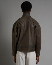 Giacca in pelle cropped con chiusure a scatto