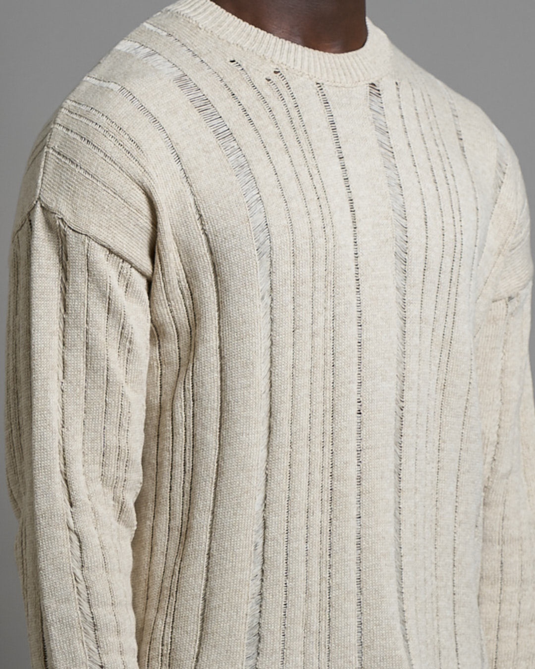 Maglia cropped in filo fluttuante