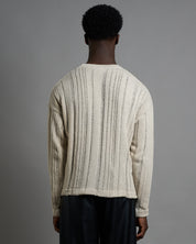 Maglia cropped in filo fluttuante