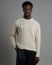 Maglia cropped in filo fluttuante