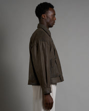 Giacca in pelle cropped con chiusure a scatto